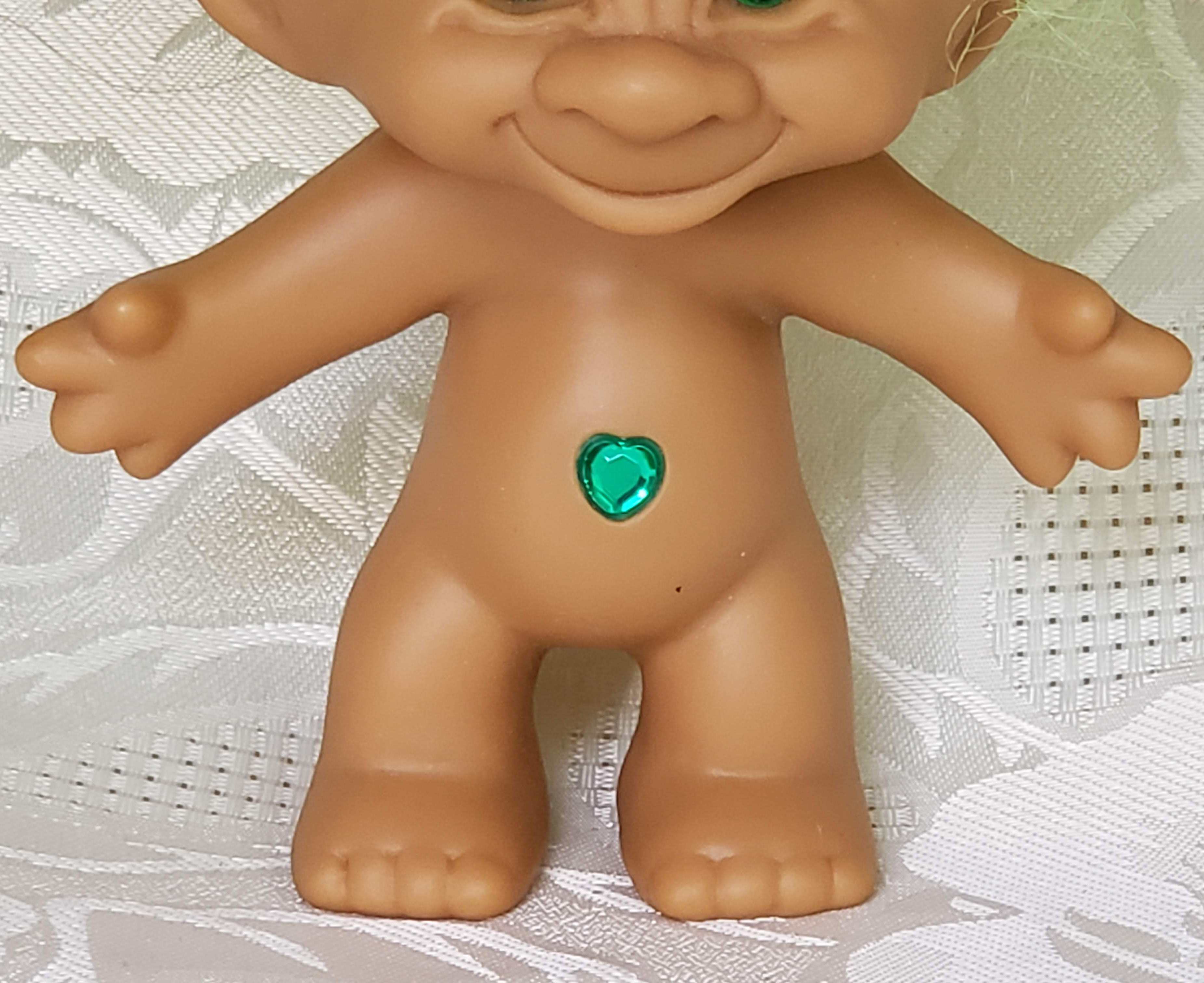 troll doll with gem in belly