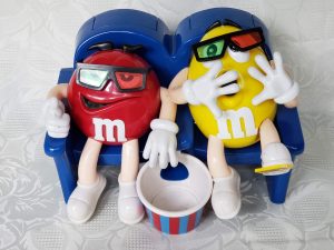 Yellow and Red M&M Watching Movies Candy Dispenser