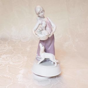 Porcelain Musical Lladro Style Figurine Girl Carrying Basket of Puppies